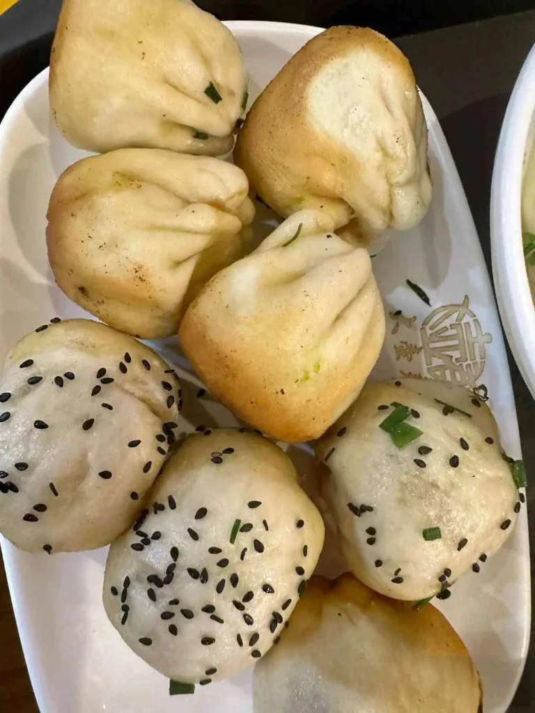 Crab roe and pork buns and xiaolongbao at Dahuchun Restaurant in Shanghai