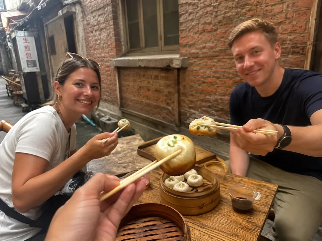 Tasting shengjian with friends in Shanghai lane